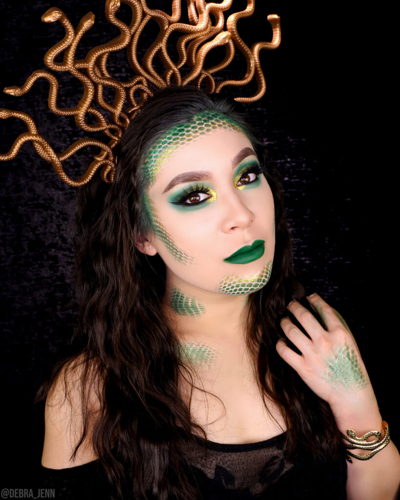 Medusa makeup for halloween with snake scales and green eyeshadow and lips