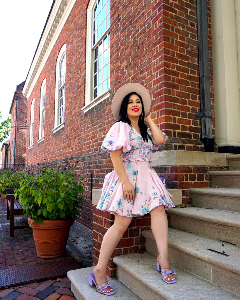 Debra Jenn wearing purple summer dress in colonial williamsburg