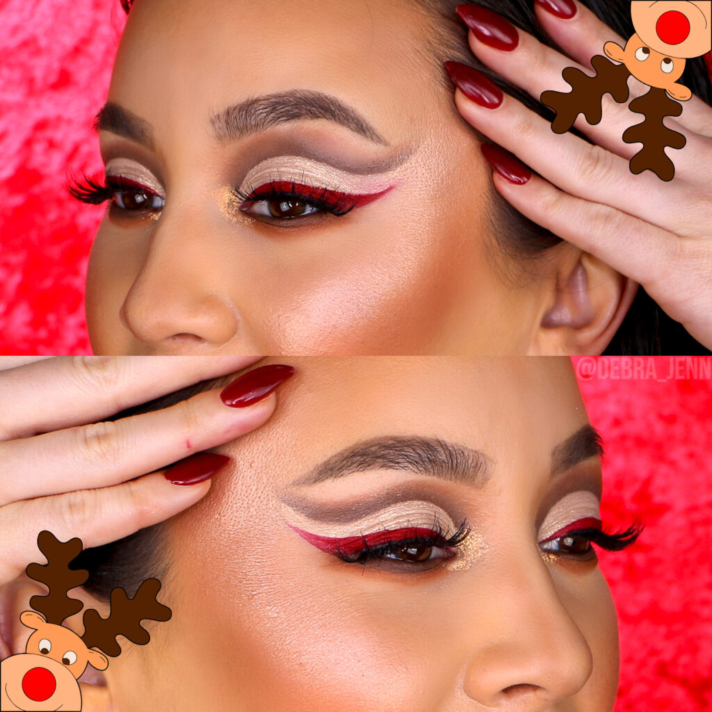 Debra Jenn in the perfect Christmas cut crease with brown and sparkly white cut crease, red winged eyeliner, and glossy red lips
