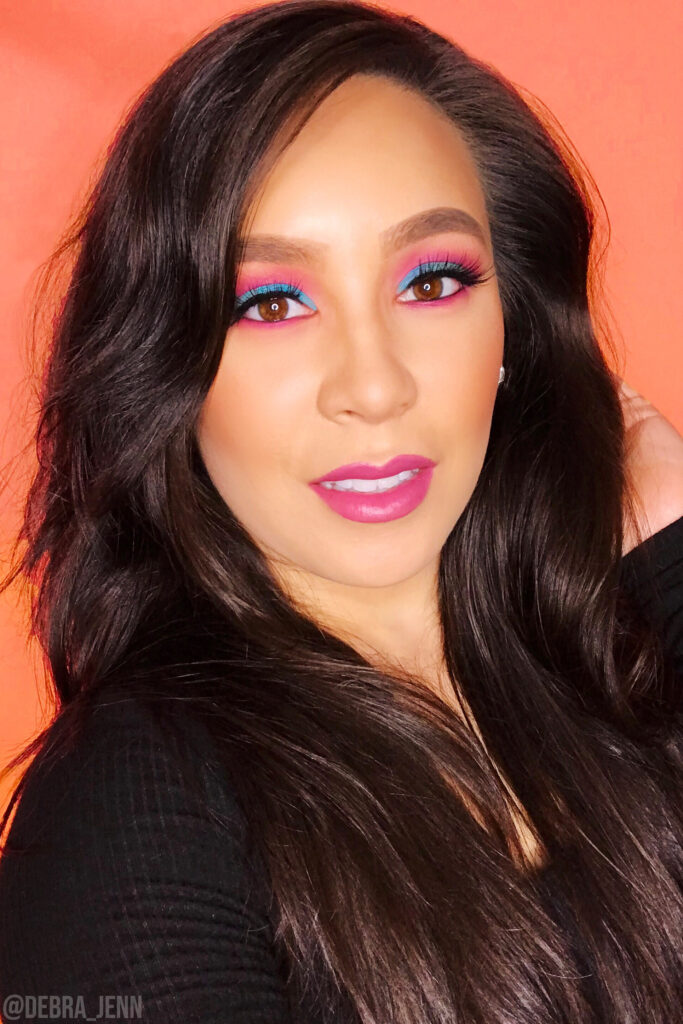 debra jenn in pink and blue eyeshadow with pink lipstick